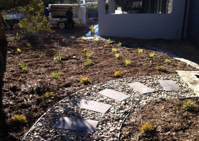 Landscaped garden with path in Hawker