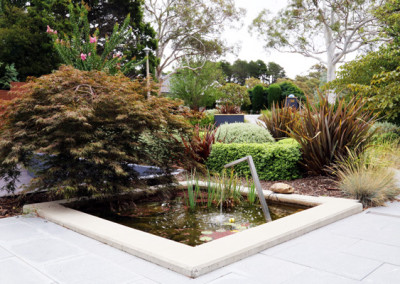 Front garden design with a water feature