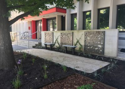 Travertine pavers, decorative screens and jasmine