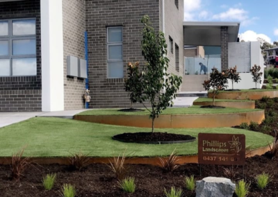 Front garden with curved corten steel edging