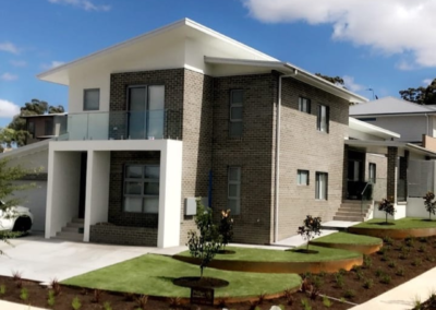 Front garden with curved corten steel edging, installed by Phillips Landscapes