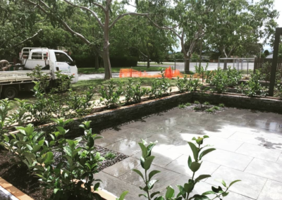 Artisan stone paving, stackstone and viburnum front courtyard